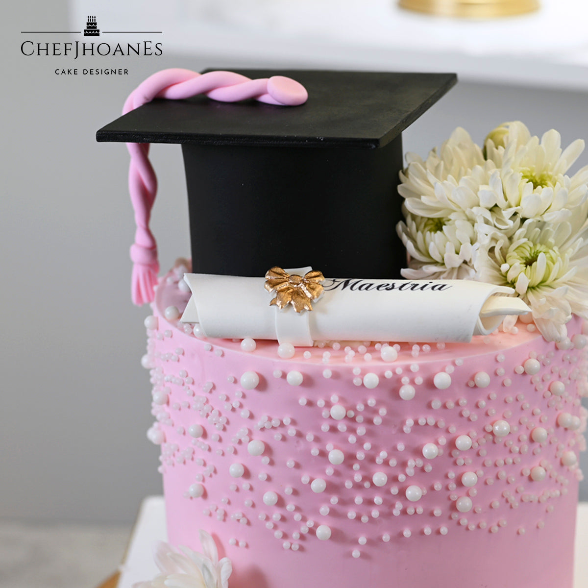 Pink pearly graduation cake. Feed 15 people.